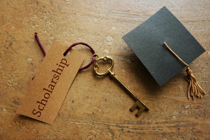Gold key with Scholarship tag,